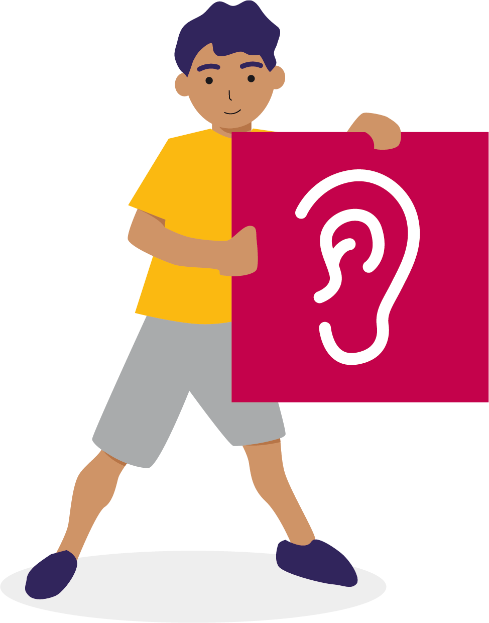 A young boy smiling and holding a sign with an era on it, indicating "listen".